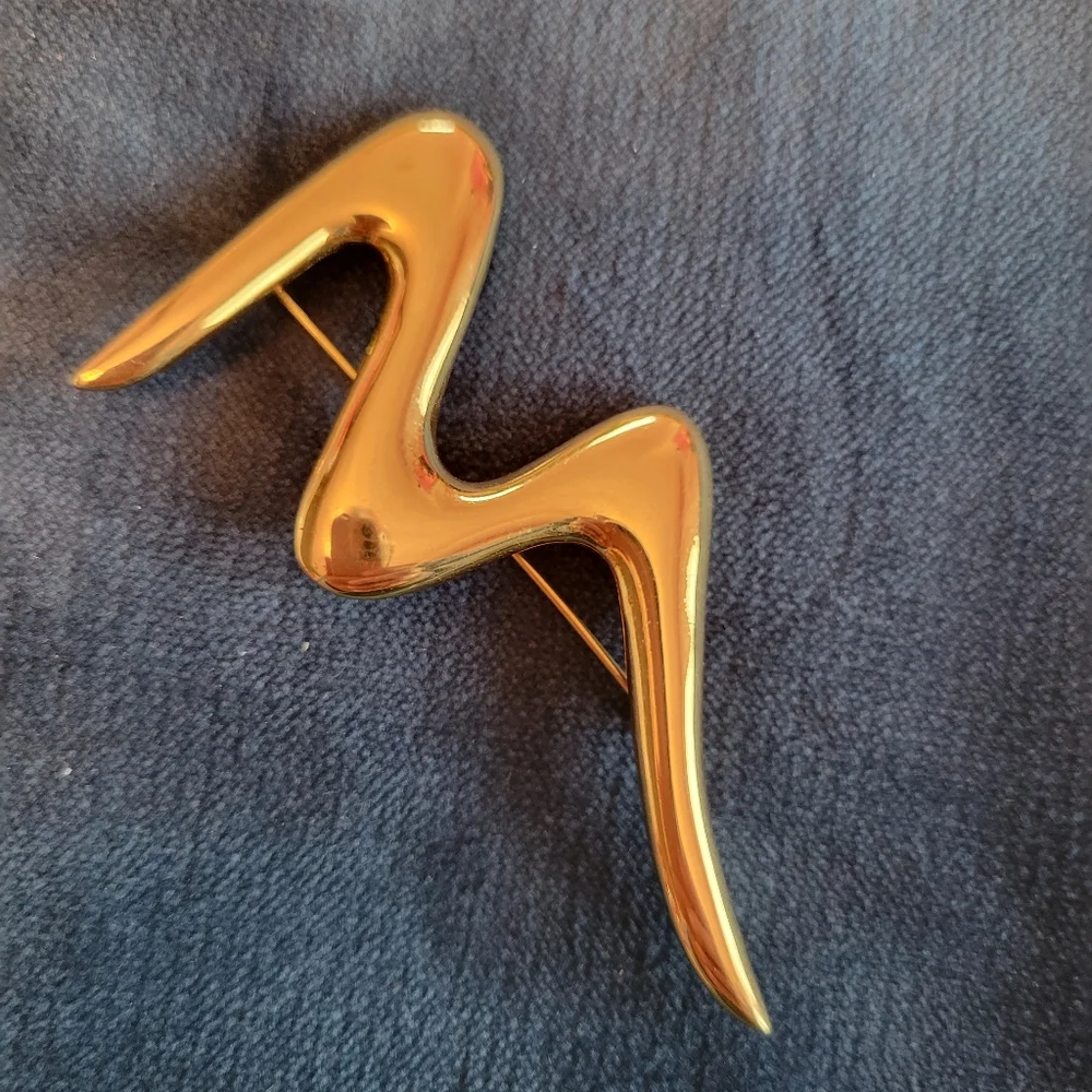 Trifari trio brooches